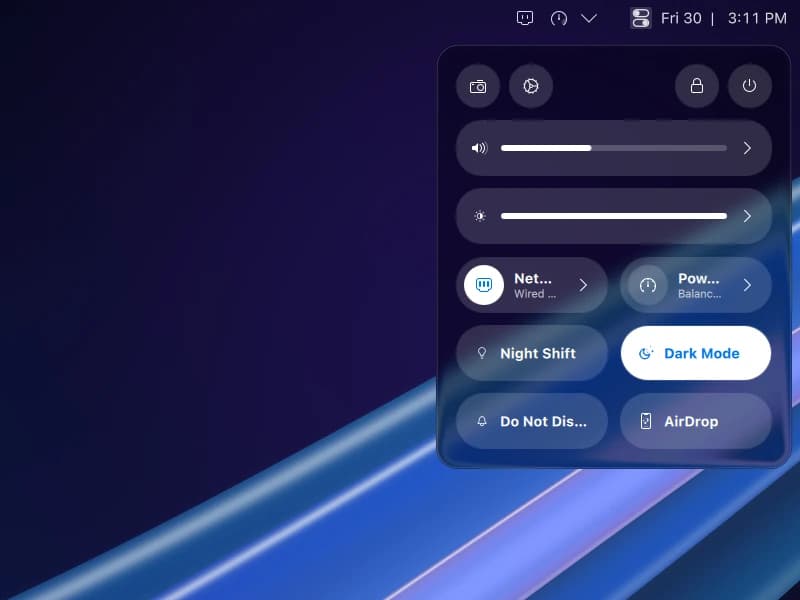 Control Center open below the menu bar: sound and brightness sliders, then network, power, Night Shift, Dark Mode, Do Not Disturb and AirDrop as pill toggles.