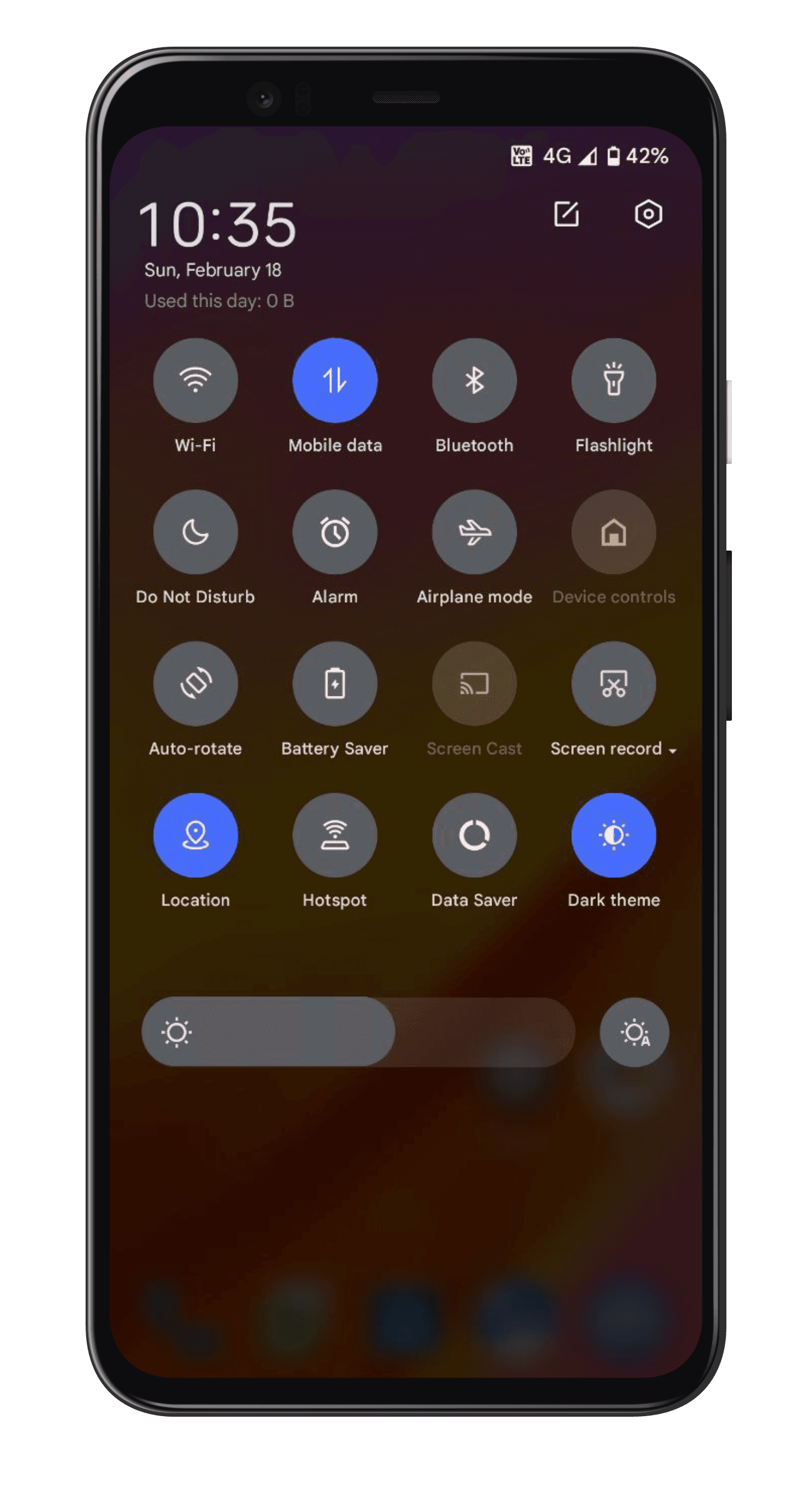 Quick settings. The full tile grid pulled down over the wallpaper, with brightness beneath it.